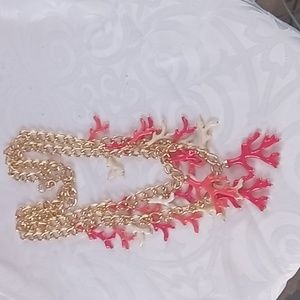 Lilly Pulitzer gold link necklace with coral charms.